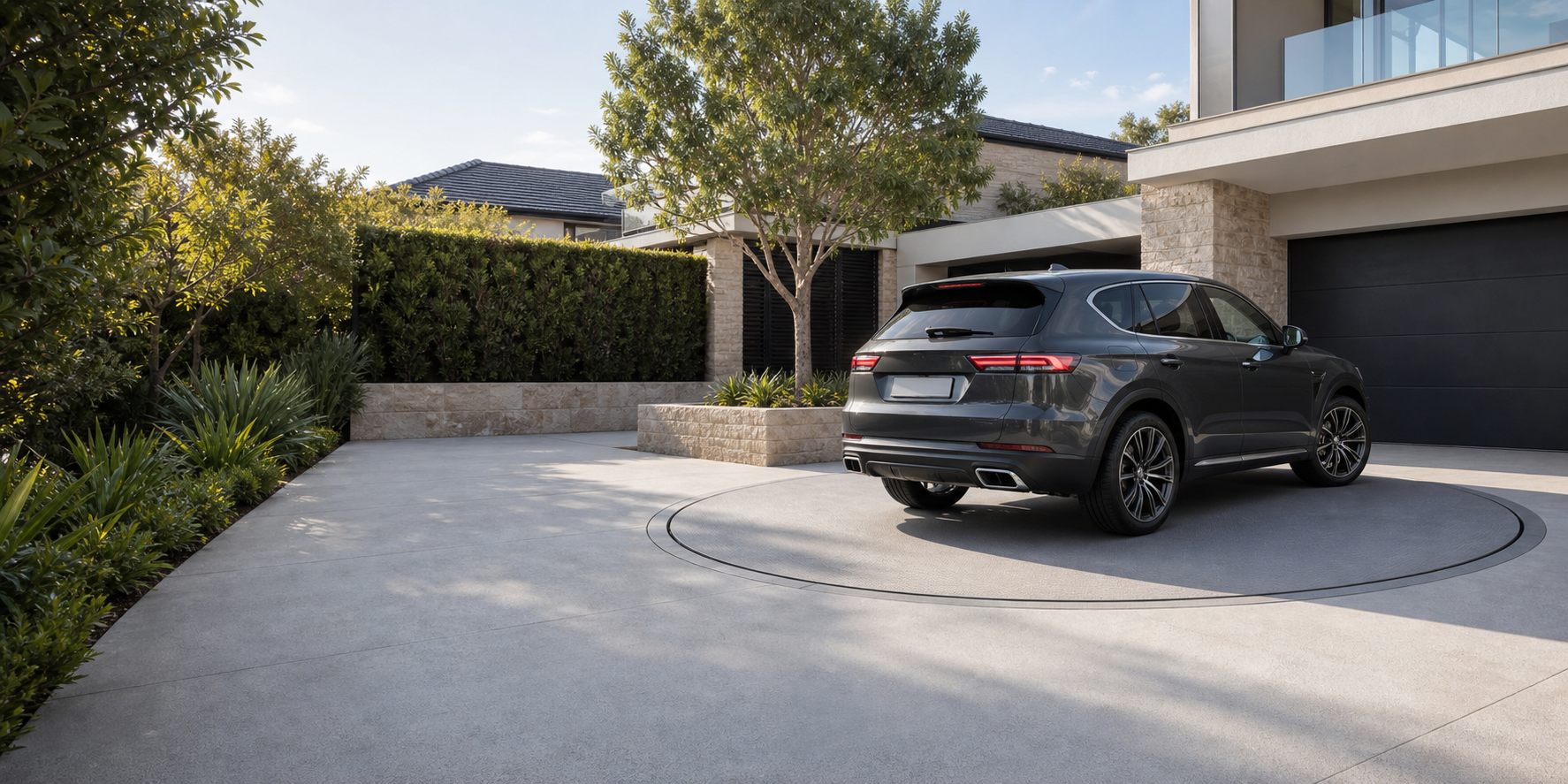 Modern Sydney driveway with a circular car turntable installed into the paving